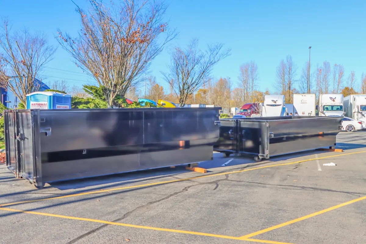 Professional dumpster rental service with roll-off container on residential driveway in Eagleton Village